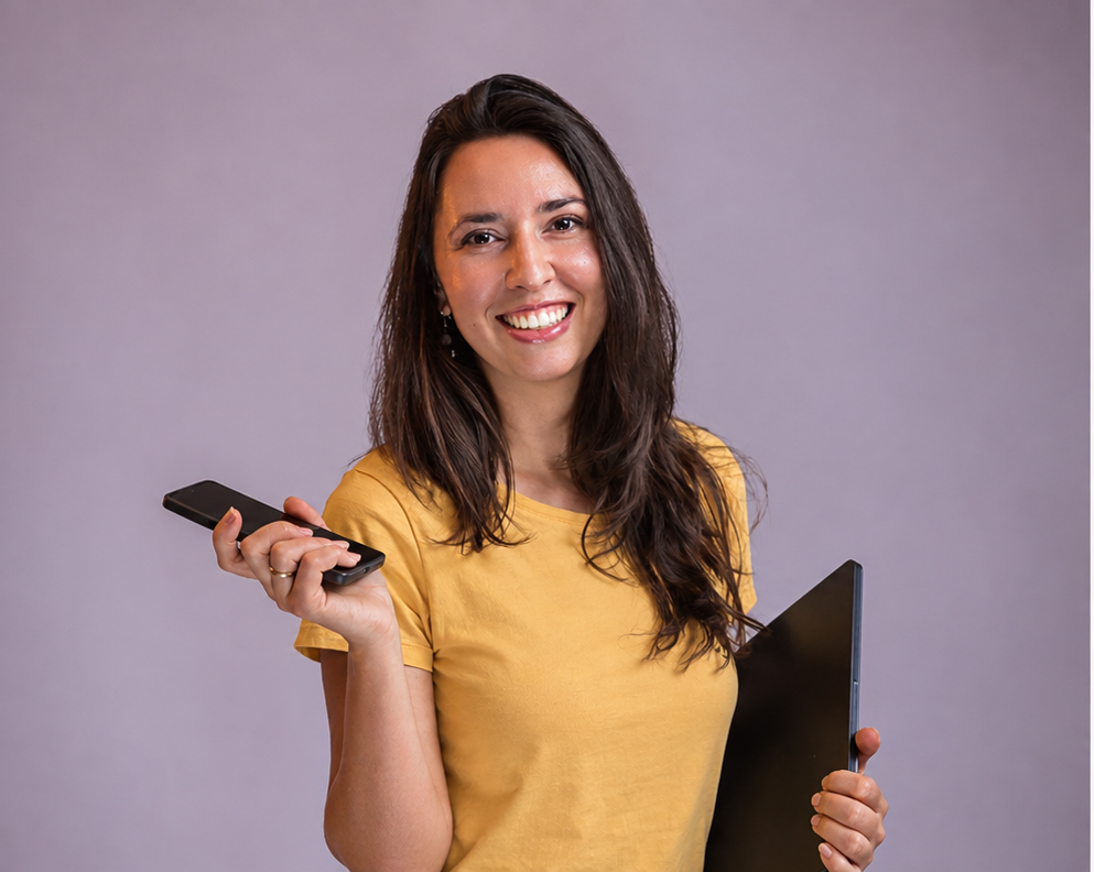 Maya Disheva — Instagram strategist and business coach, holding a phone and laptop